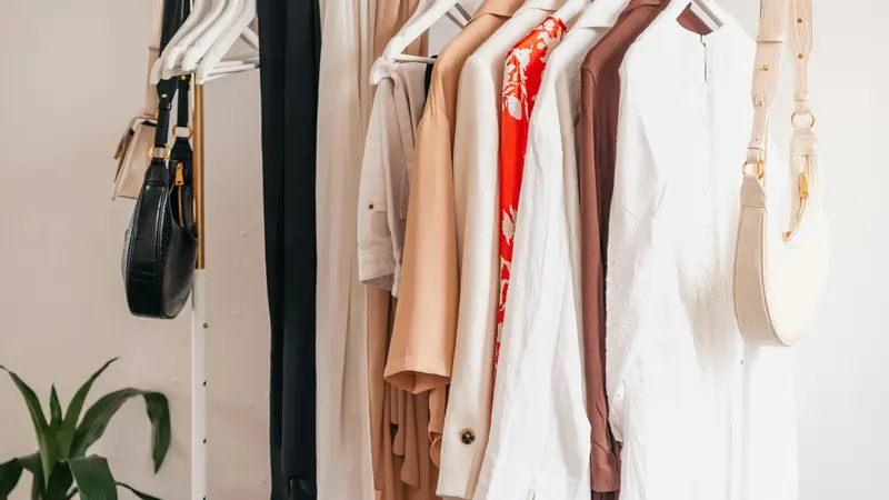 A rail filled with items of clothing on hangers